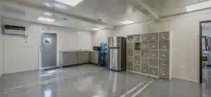 Spacious break room with lockers fridge and kitchenette in an industrial setting